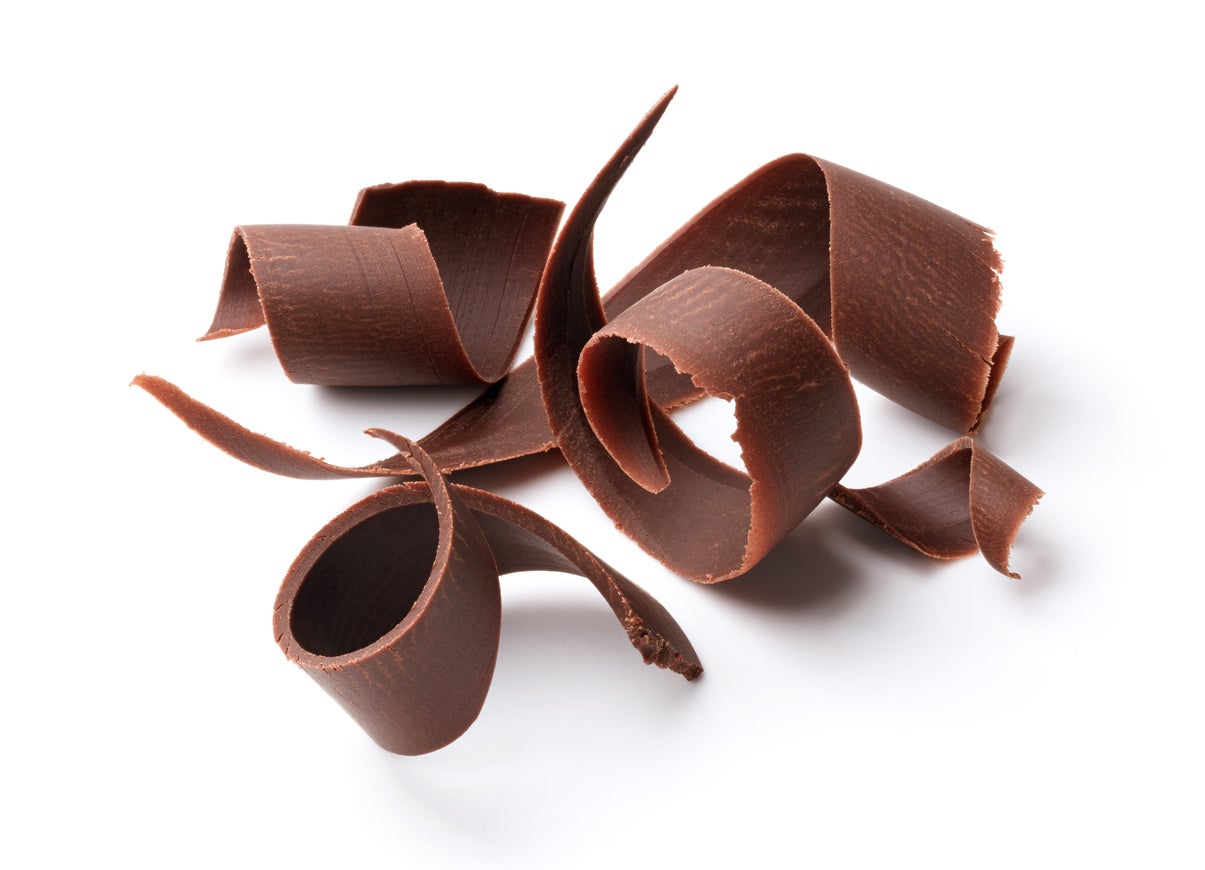 group of dark chocolate shavings isolated on white