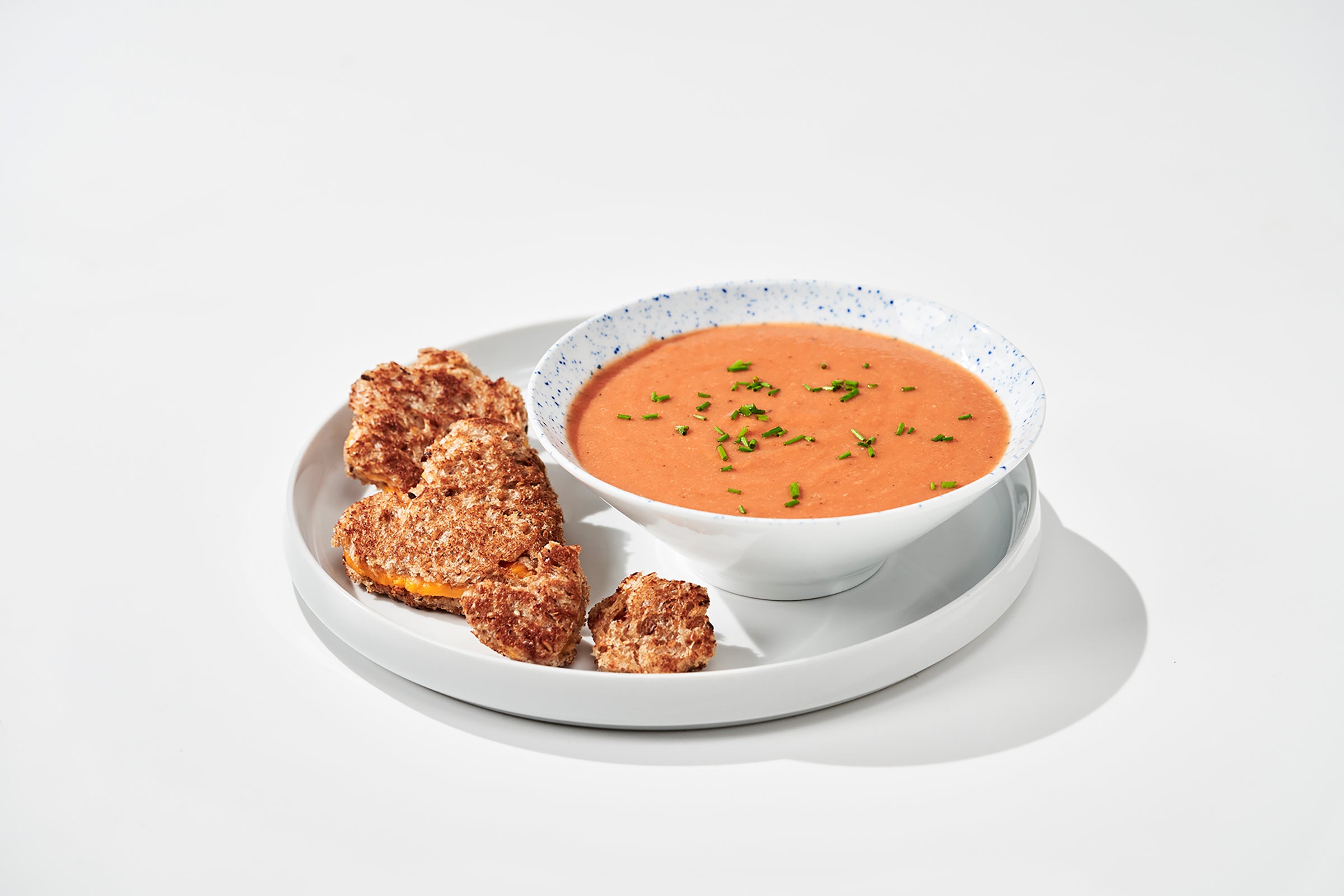 Vegan tomato soup and grilled cheese sandwich