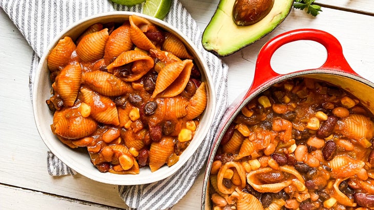 Bowl next to a pot of Instant Pot chili mac