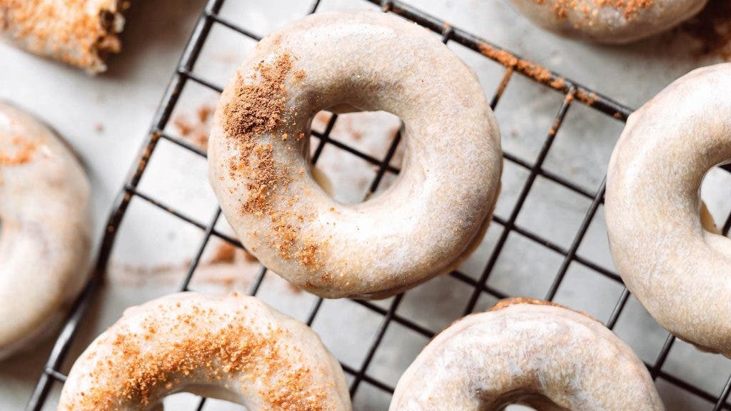 Pumpkin spice latte donuts on a cooling rack