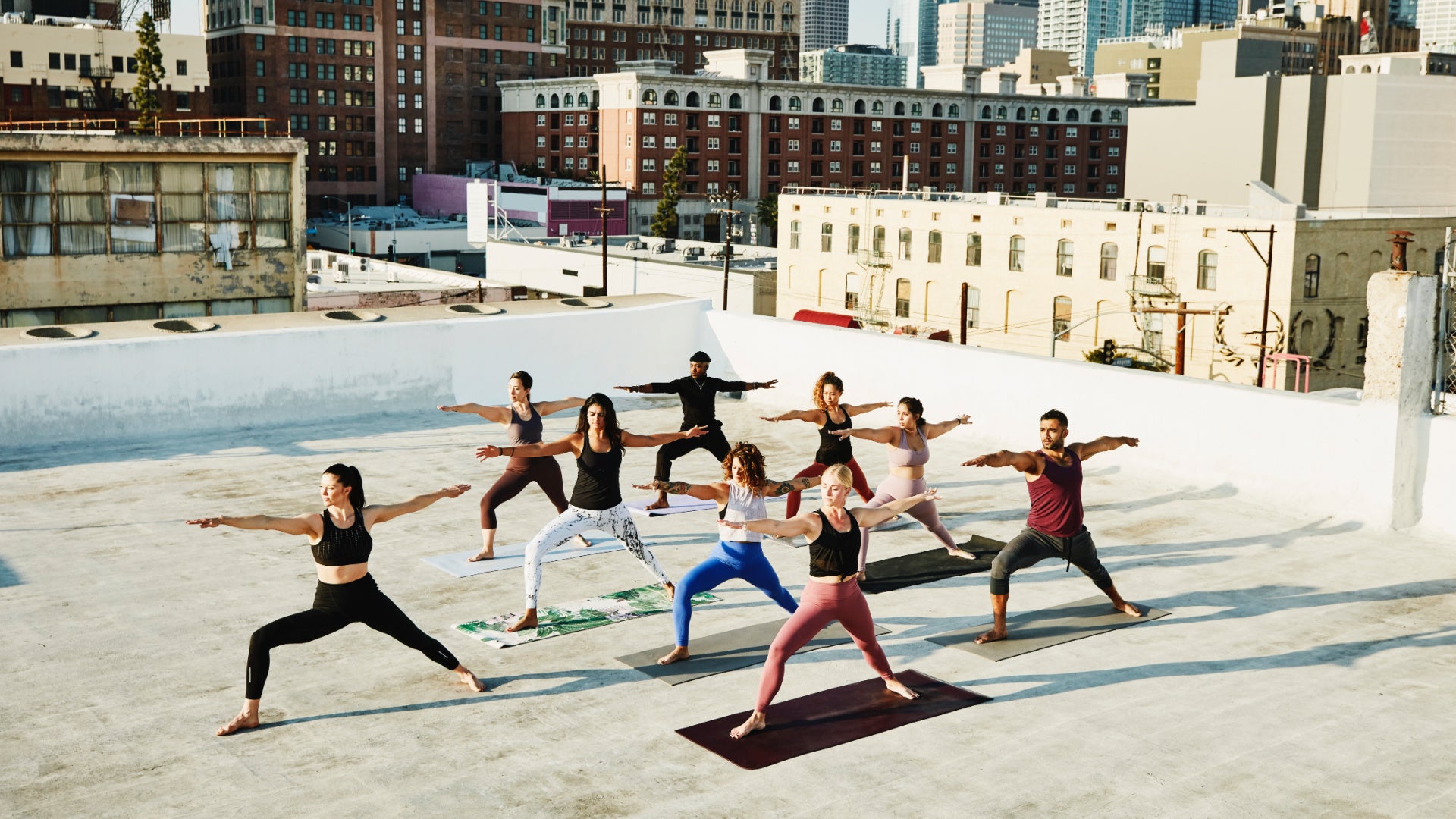 photo of a rooftop yoga class to illustrate a story about vegan yoga