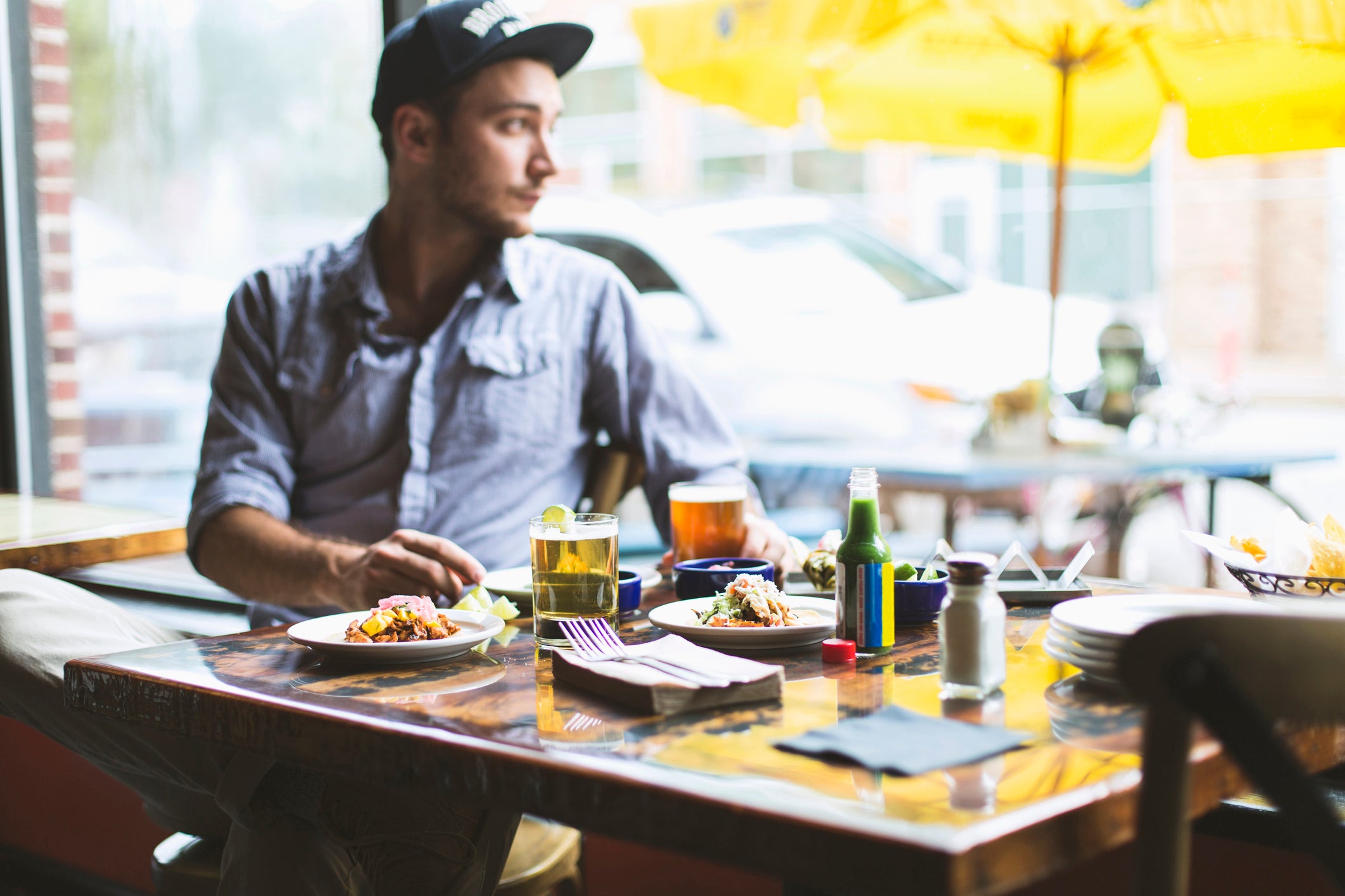 st Louis plant-based restaurant week man eating in restaurant